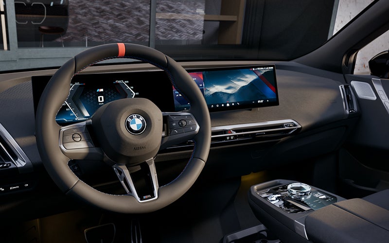 Interior steering wheel and dashboard of the BMW iX M70. | BMW of Tallahassee in Tallahassee FL